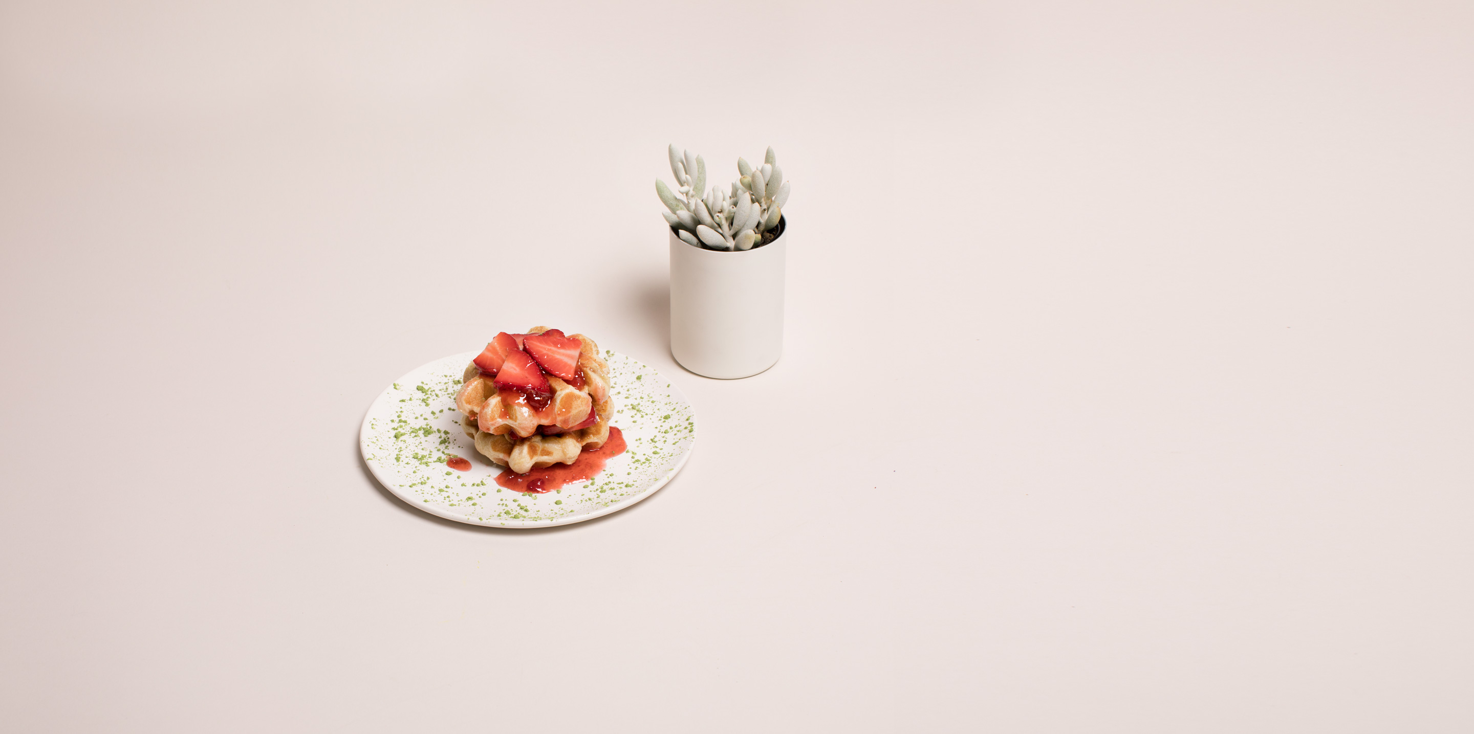 Cricket-flour waffle with kombucha strawberry compote and moringa powder
